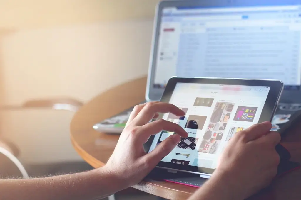 Person using a digital planner app on a tablet with stylus